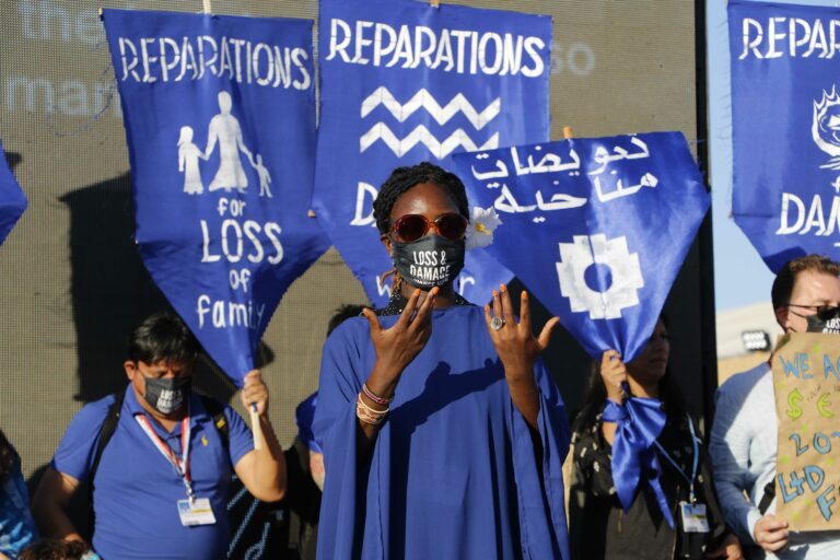 women in blue protest in COP27